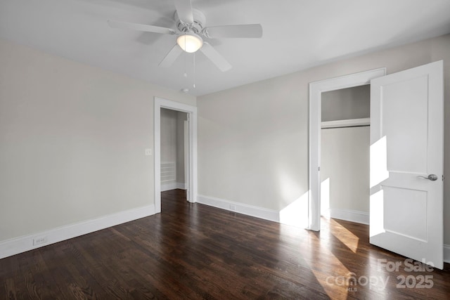 unfurnished bedroom featuring a closet, ceiling fan, and dark hardwood / wood-style flooring