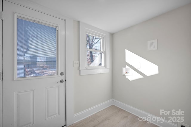 doorway to outside featuring light hardwood / wood-style flooring