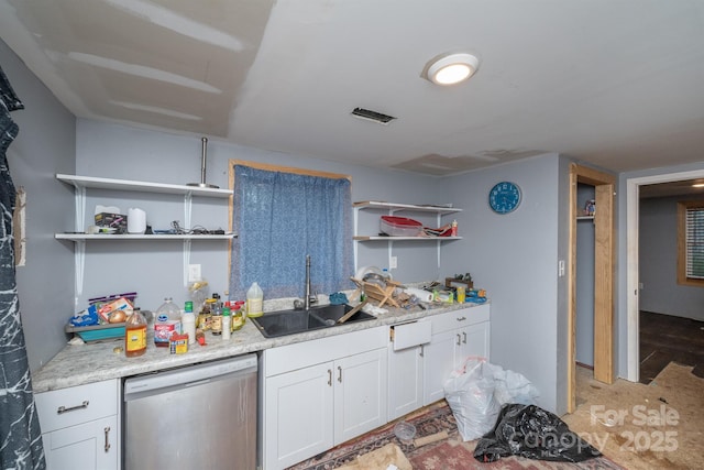 kitchen with sink, stainless steel dishwasher, white cabinetry, and light stone countertops