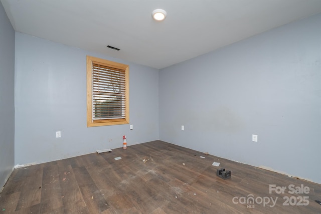 empty room with hardwood / wood-style floors