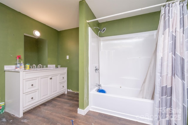 bathroom featuring shower / bath combo, hardwood / wood-style flooring, and vanity