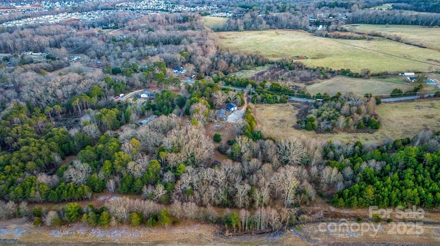 birds eye view of property featuring a rural view