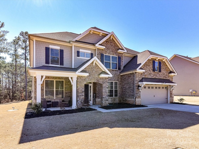 craftsman-style house with covered porch and a garage