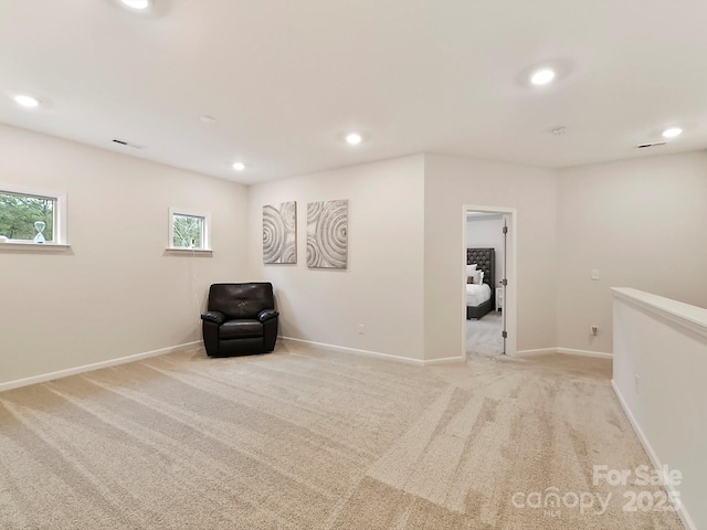 unfurnished room with light colored carpet