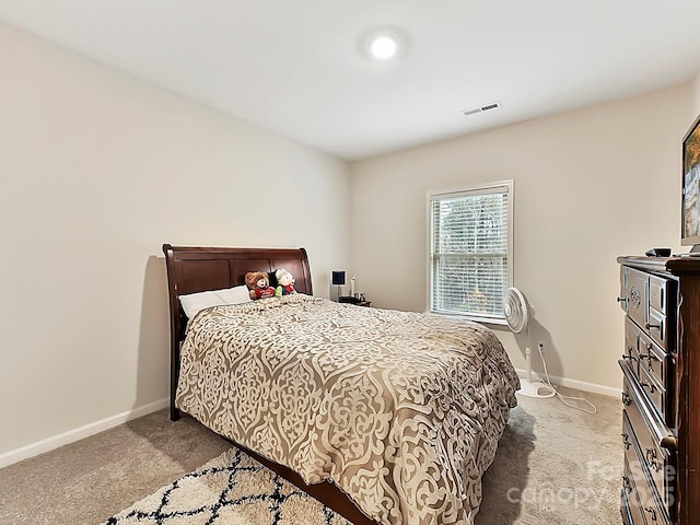 bedroom with light carpet