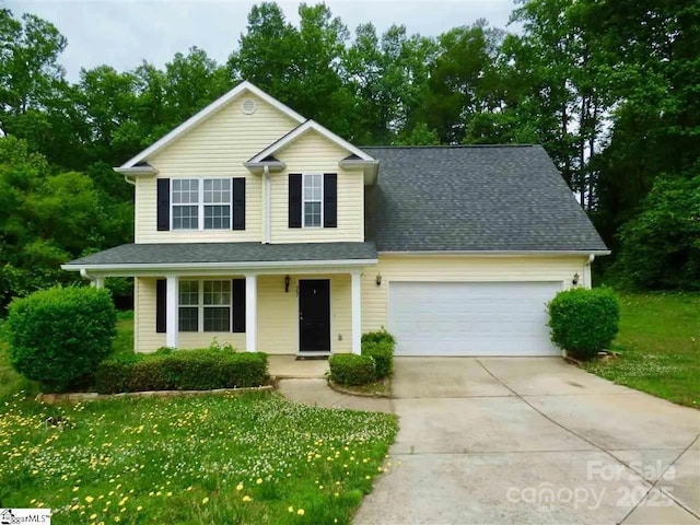 front of property featuring a garage and a front yard