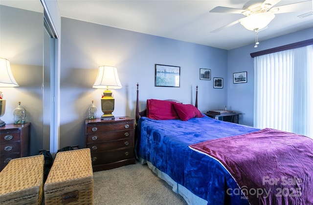 bedroom featuring a ceiling fan, a closet, light carpet, and visible vents