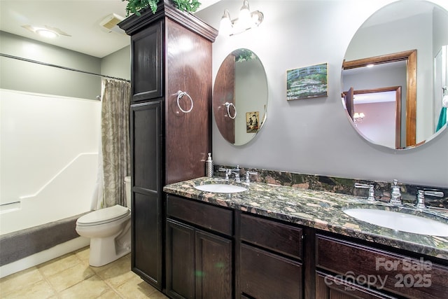 bathroom featuring toilet, shower / bathtub combination with curtain, double vanity, and a sink