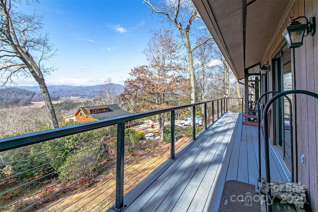 wooden terrace with a mountain view