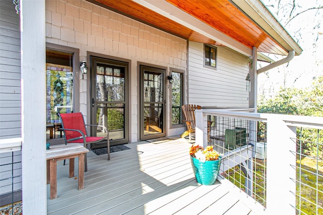 wooden terrace featuring central air condition unit