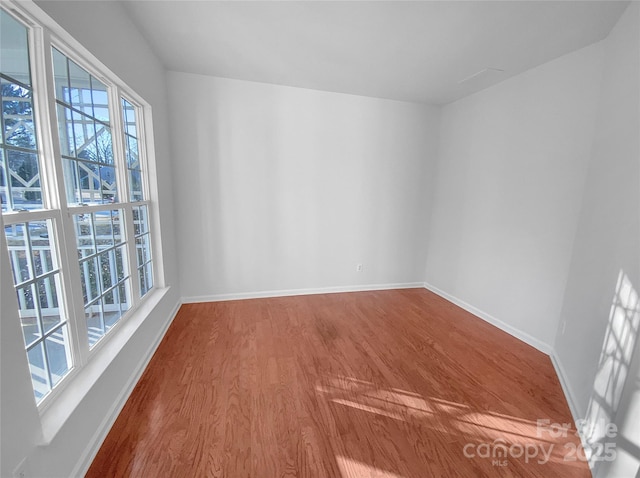 spare room featuring hardwood / wood-style floors