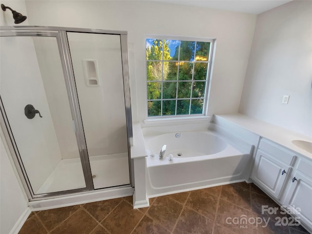 bathroom featuring vanity and separate shower and tub