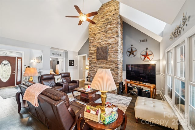 living room featuring ceiling fan, hardwood / wood-style flooring, high vaulted ceiling, and a healthy amount of sunlight