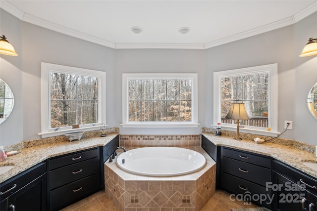 bathroom featuring ornamental molding, tiled bath, vanity, and tile patterned floors