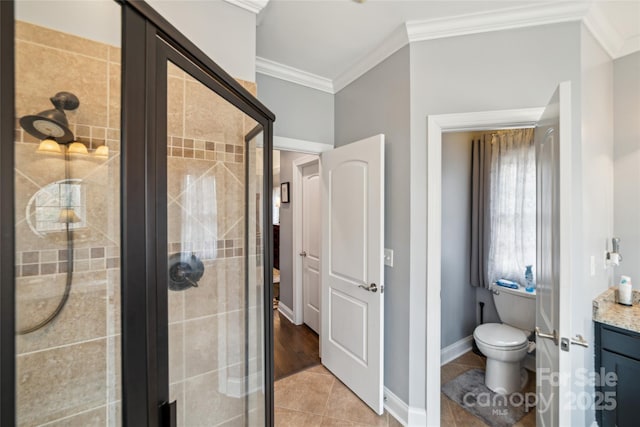 bathroom featuring tile patterned flooring, vanity, walk in shower, toilet, and crown molding