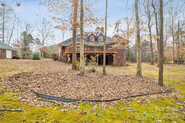 rear view of property with a deck