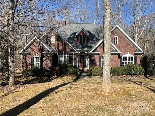 2113 Sweet Clover Way, Denver, NC 28037 - view of front of home with a chimney and a front lawn