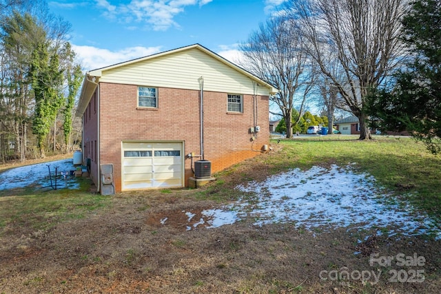 exterior space featuring a garage and central AC unit