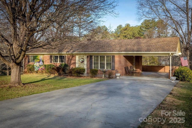 ranch-style home with a carport and a front lawn