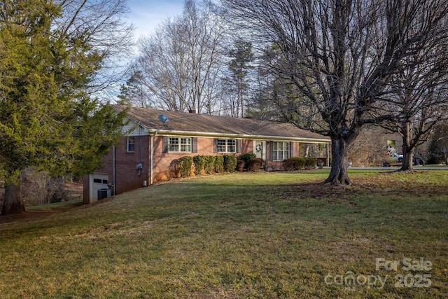 single story home with a front lawn and central AC