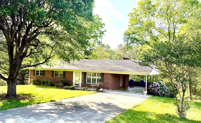 104 Tron Park Ave NE, Valdese, NC 28690 - ranch-style house with concrete driveway, a front yard, brick siding, and a carport
