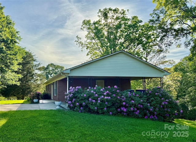 104 Tron Park Ave NE, Valdese, NC 28690 - view of home's exterior featuring a yard and a patio area