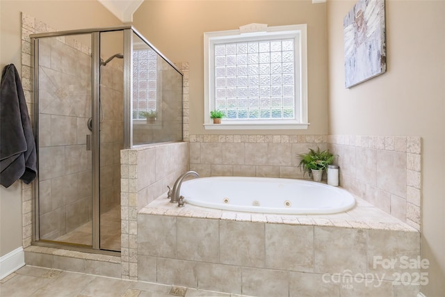 bathroom with tile patterned flooring and separate shower and tub