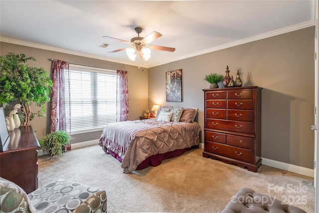 carpeted bedroom featuring crown molding and ceiling fan