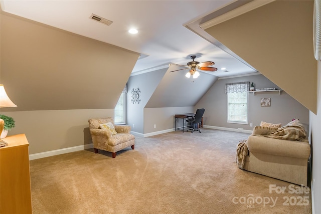 sitting room with crown molding, lofted ceiling, light colored carpet, and ceiling fan