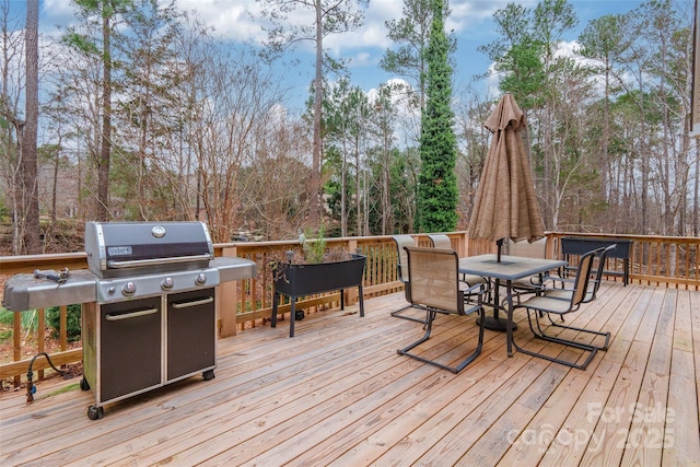 deck featuring a grill