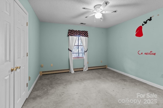 unfurnished bedroom featuring baseboard heating, ceiling fan, a textured ceiling, and light colored carpet