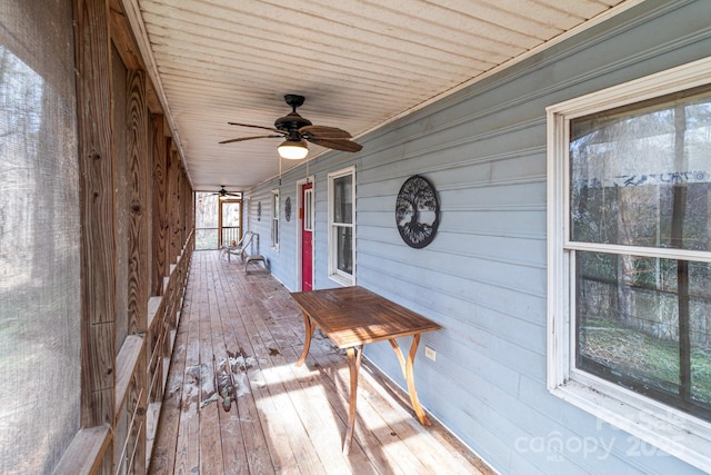 wooden deck with ceiling fan and a porch