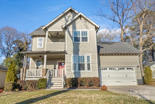 craftsman house with a garage, a front yard, and a porch