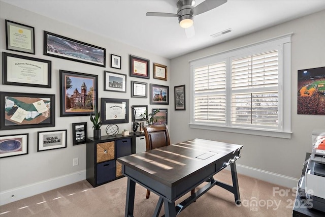 home office featuring light colored carpet and ceiling fan