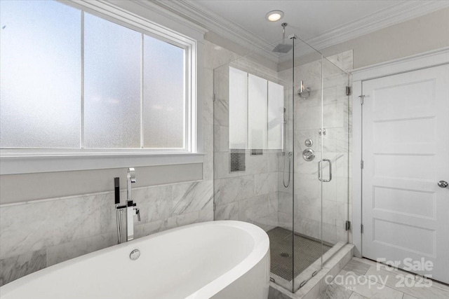 bathroom with ornamental molding, shower with separate bathtub, and tile patterned floors