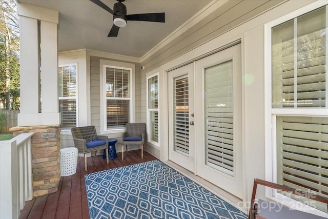 wooden deck with ceiling fan and covered porch