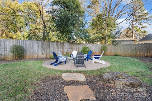 view of yard with an outdoor fire pit and a patio area