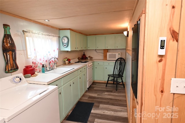 washroom with washer / clothes dryer, dark wood-type flooring, and sink