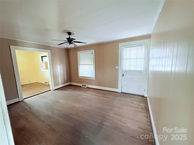 interior space featuring ceiling fan, ornamental molding, and light hardwood / wood-style floors