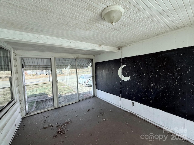 unfurnished sunroom with wood ceiling