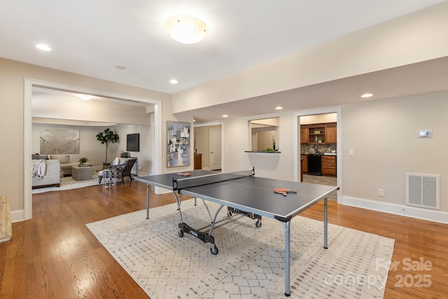 playroom with hardwood / wood-style flooring