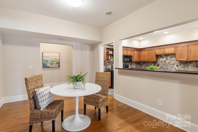 dining area with hardwood / wood-style flooring