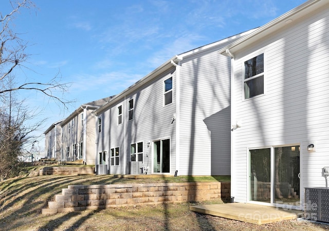 back of property featuring a patio and central AC unit