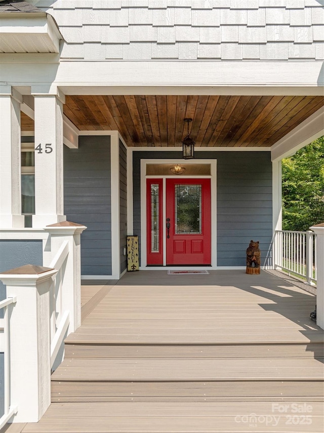 property entrance with covered porch