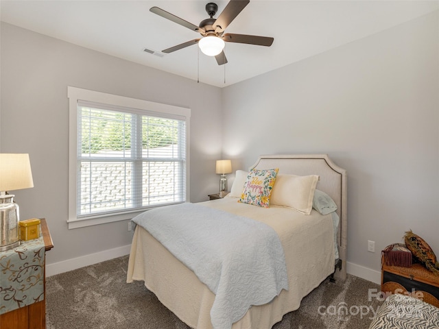 bedroom featuring dark carpet and ceiling fan