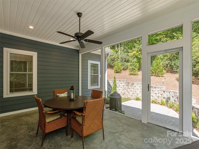 sunroom / solarium with ceiling fan