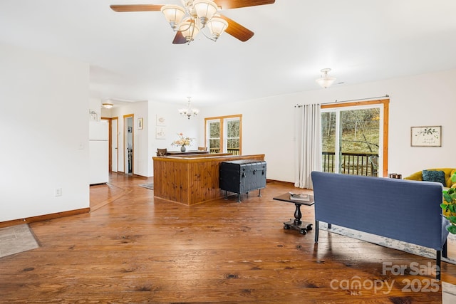 living room with hardwood / wood-style flooring and ceiling fan