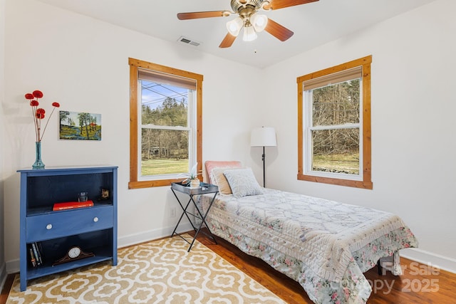 bedroom featuring wood-type flooring and ceiling fan