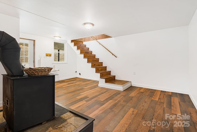 stairs featuring hardwood / wood-style flooring