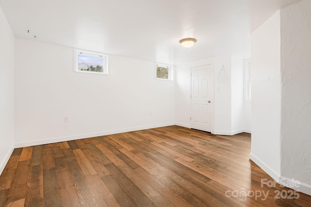 unfurnished room featuring hardwood / wood-style floors